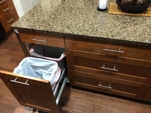 Kitchen Island has extra thick granite top
with recycling drawer and deep pot drawers